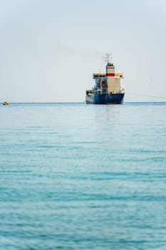 Oil chemical tanker anchored in the Mediterranean sea on a cloudy day