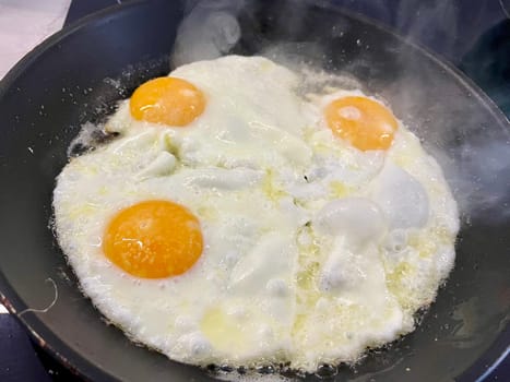An egg is prepared in a pan for breakfast. High quality photo