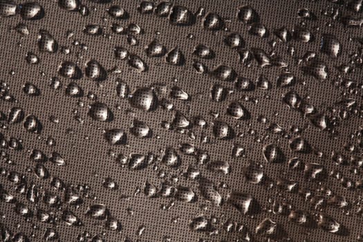 Abstract dark background with lot of water drops