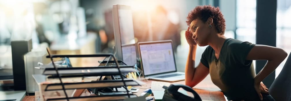 Business woman, stress and back pain on computer for human resources report, confused or fatigue in office. African worker with headache and overworked on desktop for payroll mistake on a banner.