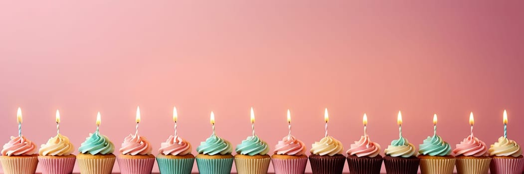 Colorful cupcakes with lit candles are displayed against a pink background, indicating an indoor celebration event marking of joy and celebrating. with free space.