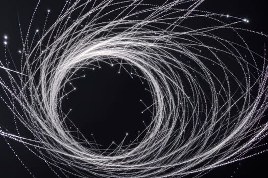 The image is a circular shape made up of lines and dots.