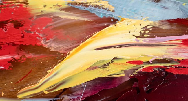 Closeup of a painting by oil and palette knife. Fragment of multicolored texture painting. Abstract art background. oil on canvas. Rough brushstrokes of paint.