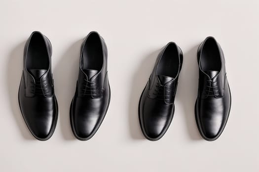 The image shows a pair of black leather shoes with laces and a pair of black leather dress shoes with laces.