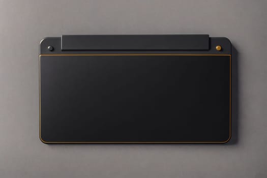 The image is a grey rectangular box with a small handle on the top and a small opening on the front.