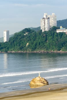 Pedra Da Feiticeira statue on the beach of Sao Vicente, Brazil. April 2 2024.
