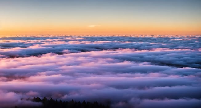 The image is a photograph of a cloudy sky with mountains in the background.