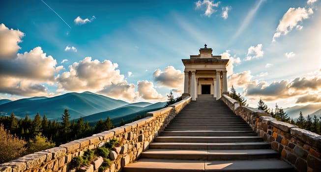 The image shows a staircase leading up to a white stone monument with a cross on top, surrounded by mountains in the background.