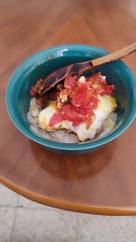 egg with tomatoes, green plate breakfast food. High quality photo