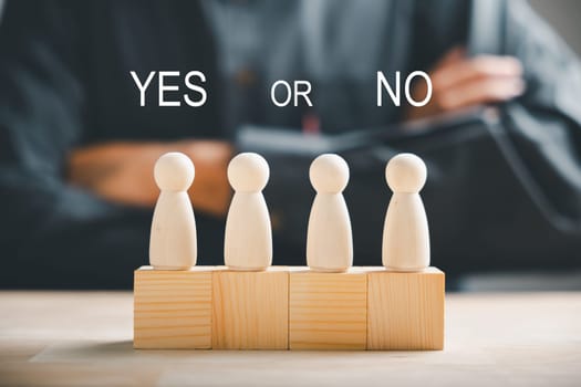 Wooden cube with peg dolls, yes or no choices. Man's decision-making shown with two options. Red question mark enhances the concept. Think With Yes Or No Choice.