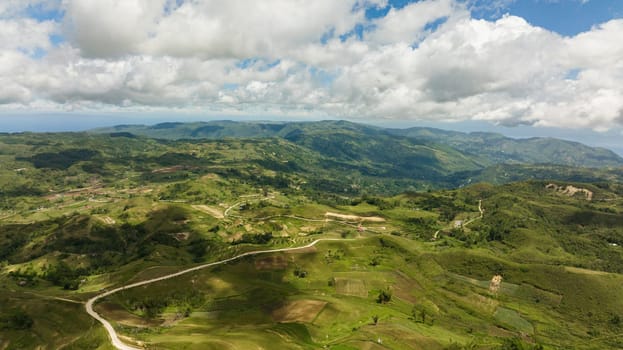 Agricultural land among hills and mountains in a mountainous province. Libo hills. Cebu island, Philippines.