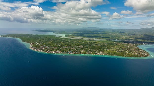 Top view of coast of Moalboal with hotels and dive centers. A popular place for divers. Philippines, Cebu.