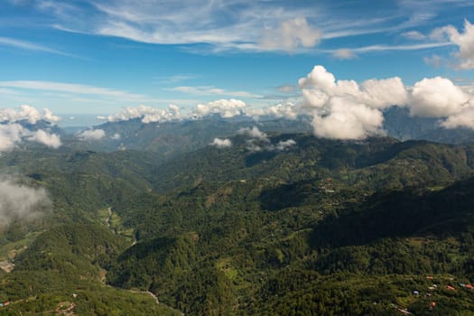 Mountain peaks covered with forest from above. Philippines.