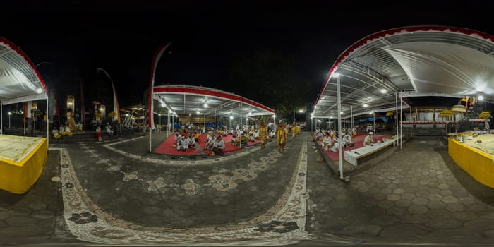 Bali - Sep, 2022: Men in traditional dress perform a ritual dance in the temple. Indonesia. Virtual Reality 360.