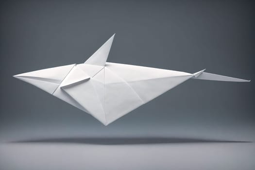 The image is a white paper origami shark with sharp teeth and a long tail.