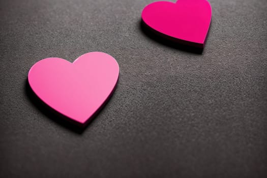 The image is a pink heart shape on a gray background.