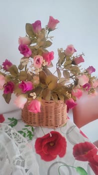 beautiful artificial rose flowers, bouquet in a vase on the table,. High quality photo