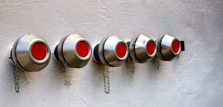 Fire hydrant and the walls of the building. Fire hydrant close-up.