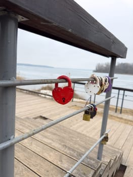 colorful locks hanging on the railings