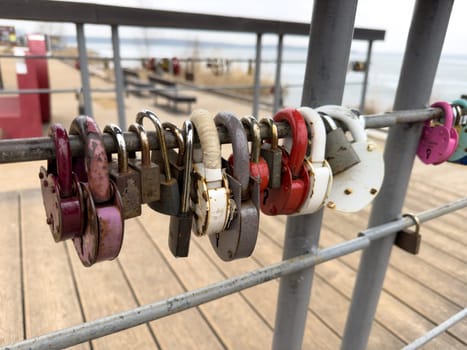 colorful locks hanging on the railings