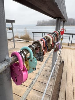 colorful locks hanging on the railings