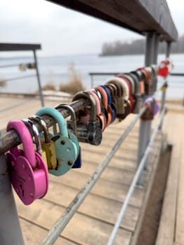 colorful locks hanging on the railings