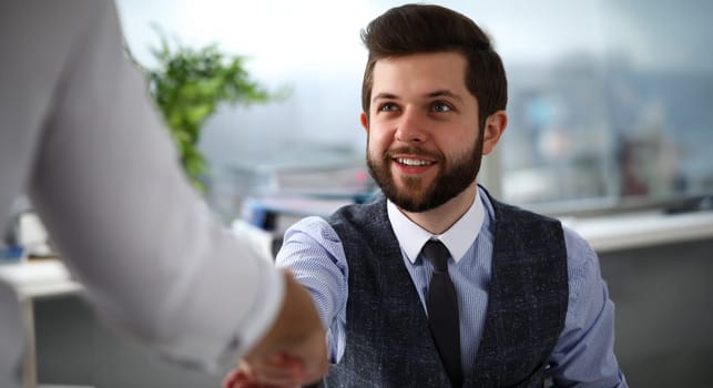 Man in suit and tie give hand as hello in office portrait. Friend welcome mediation offer positive introduction thanks gesture summit executive approval motivation male arm strike bargain