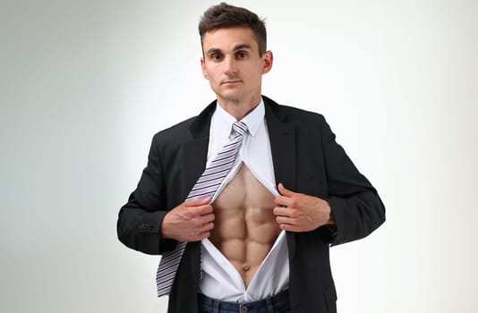 man in tie rip clothes off torso showing abs. Super human reveal, white collar healthy life style, perfect muscular train, weight loss, wellness nutrition, powerful job concept
