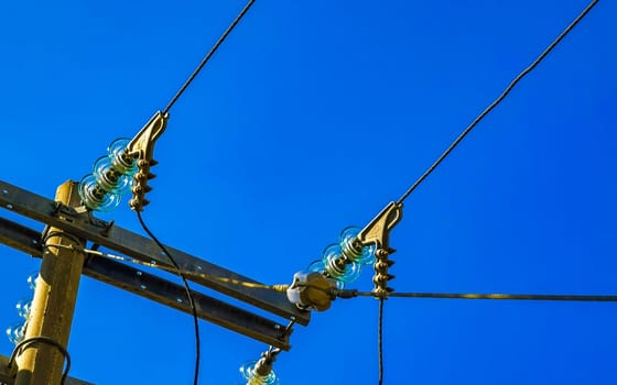 Power pole cable box with blue sky in Zicatela Puerto Escondido Oaxaca Mexico.