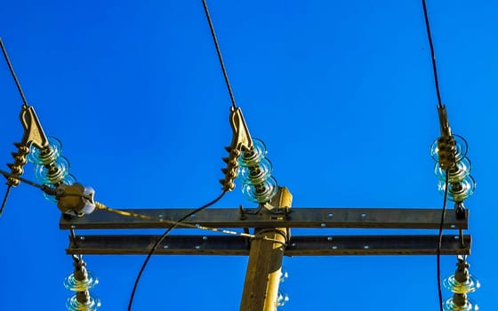 Power pole cable box with blue sky in Zicatela Puerto Escondido Oaxaca Mexico.