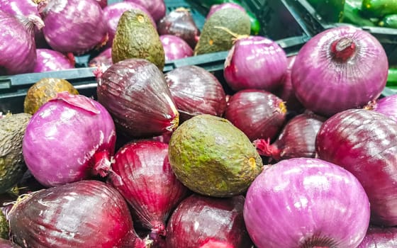 Onions onion red purple and white vegetables on the market in Zicatela Puerto Escondido Oaxaca Mexico.