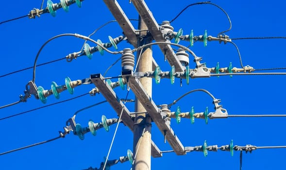 Power pole cable box with blue sky in Zicatela Puerto Escondido Oaxaca Mexico.