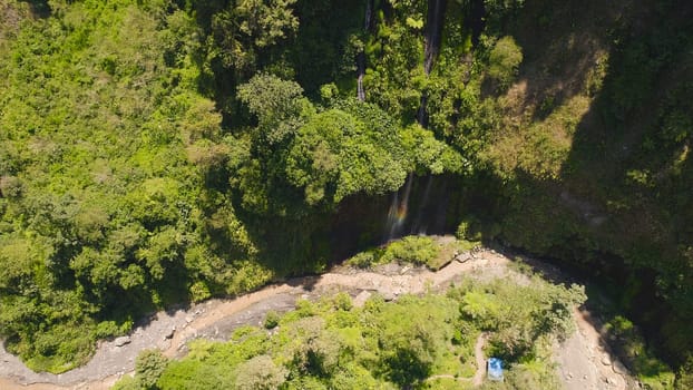 aerial view waterfall coban sewu in Java, indonesia. waterfall in tropical forest by drone Tumpak Sewu