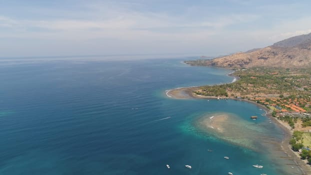 sea coast with tropical beach. aerial seascape tropical landscape, sea, boats on the surface water. Bali,Indonesia, travel concept.