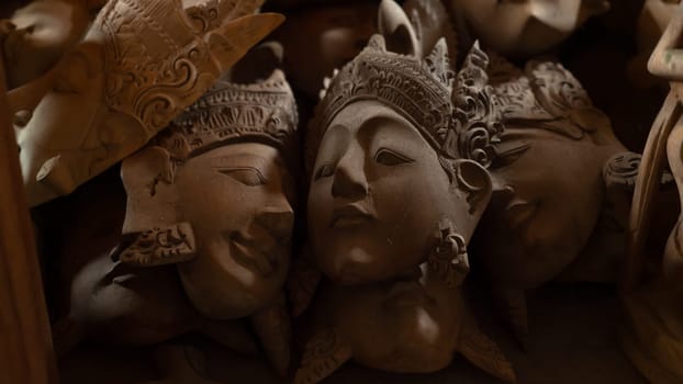 Hindu and Buddhist wooden carving. souvenir shop selling souvenirs and handicrafts of Bali at famous Ubud Market, Indonesia