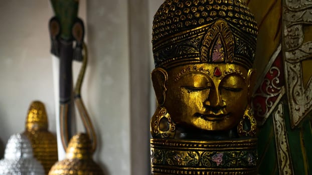 Hindu and Buddhist wooden carving. souvenir shop selling souvenirs and handicrafts of Bali at famous Ubud Market, Indonesia