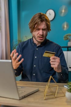 Angry mad stressed freelancer try to pay online shopping with smartphone blocked credit card. Annoyed businessman buying, bank refuse problem unsuccessful payment lack of money balance. Vertical