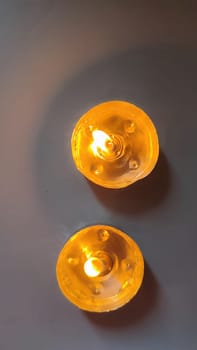 two round candles, fire objects, light . High quality photo