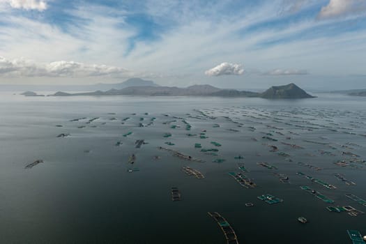 Aerial view of Fish farms on Taal Lake close to the volcano. Tagaytay City, Philippines.