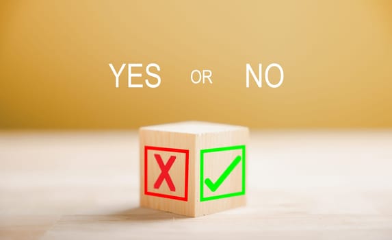 Green check mark and red x on wooden block signify decision making. Choice concept presented. Think With Yes Or No Choice.