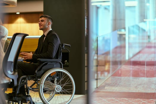 In a modern glass startup office, a wheelchair-bound director leads a successful meeting with colleagues, embodying inclusivity and teamwork