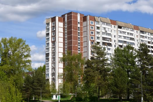 Urban residential building surrounded by trees in the Zelenograd, Moscow, Russia