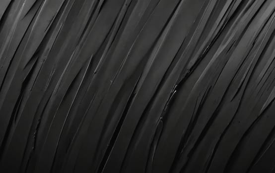 A detailed image of a black feather texture against a black background, resembling tints and shades commonly found in automotive tires and flooring materials made of synthetic rubber