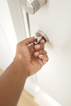 opening the front door of the apartment building