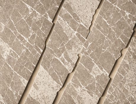The image is a beige marble wall with diagonal cracks and scratches.