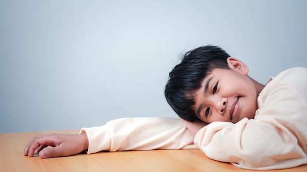 The boy was sitting and thinking about various stories, analyzing and sorting things out.