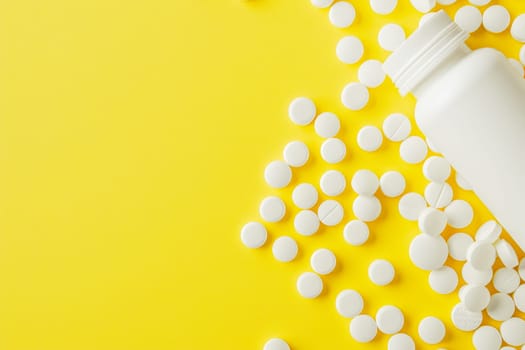 White medicine pills spilled from plastic pill bottle, on yellow background. Medicine creative concepts. Flat lay top view, copy space.