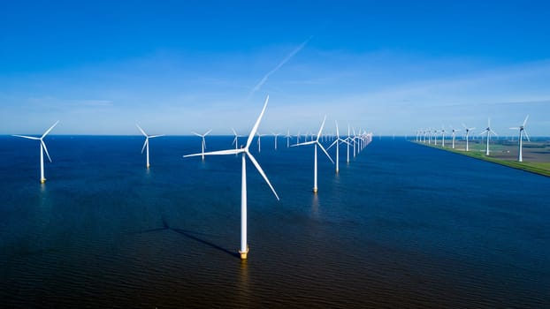 A stunning scene of countless windmills standing tall in a vast body of water, creating a mesmerizing display of renewable energy in action. windmill turbines in the ocean