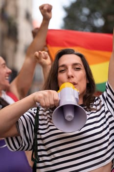 Transgender woman screaming during a protest to support LGBTQ community. Vertical.