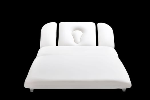 massage couch isolated on black background, cosmetic procedures